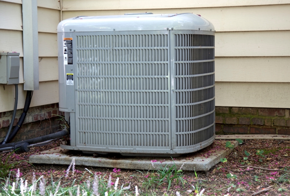 Residential air conditioner unit installed outside a home, representing choosing the right HVAC system for your home. Keywords: air conditioning, HVAC system, home cooling, heating and cooling services, ac installation near me, ac replacement near me, furnace installation near me, furnace replacement near me, hvac installation near me, hvac replacement near me, hvac technician near me. Service areas: Coeur d'Alene, CDA, Post Falls, Hayden, Rathdrum, Sandpoint, Spirit Lake, St Maries, Athol, Blanchard, Dalton Gardens, Worley, Plummer, and Harrison, ID.